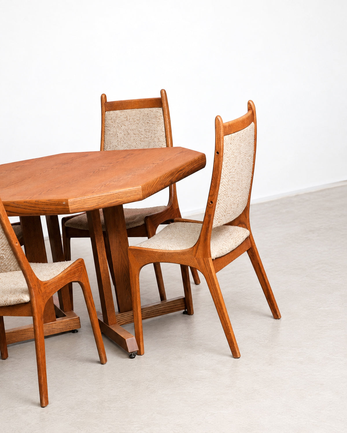 Additional angle of the dining set showing table and chair construction detail.