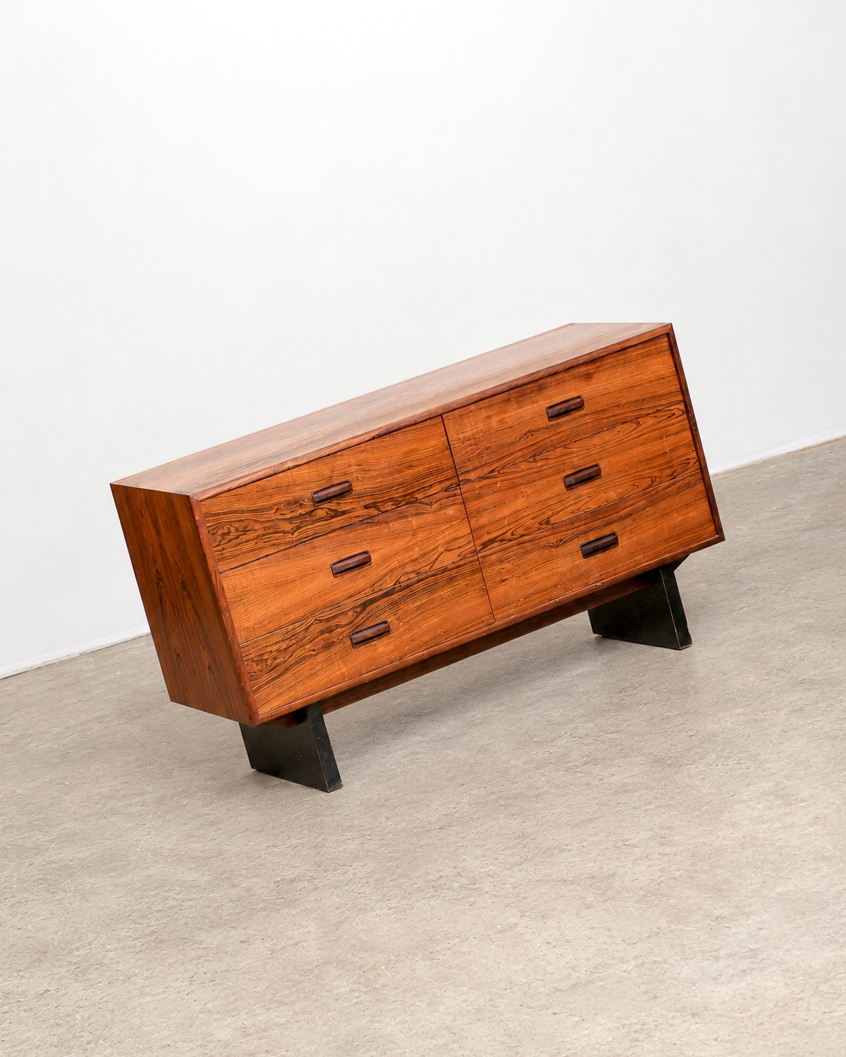 Three-quarter view of the rosewood dresser against a plain background, showing overall proportions.