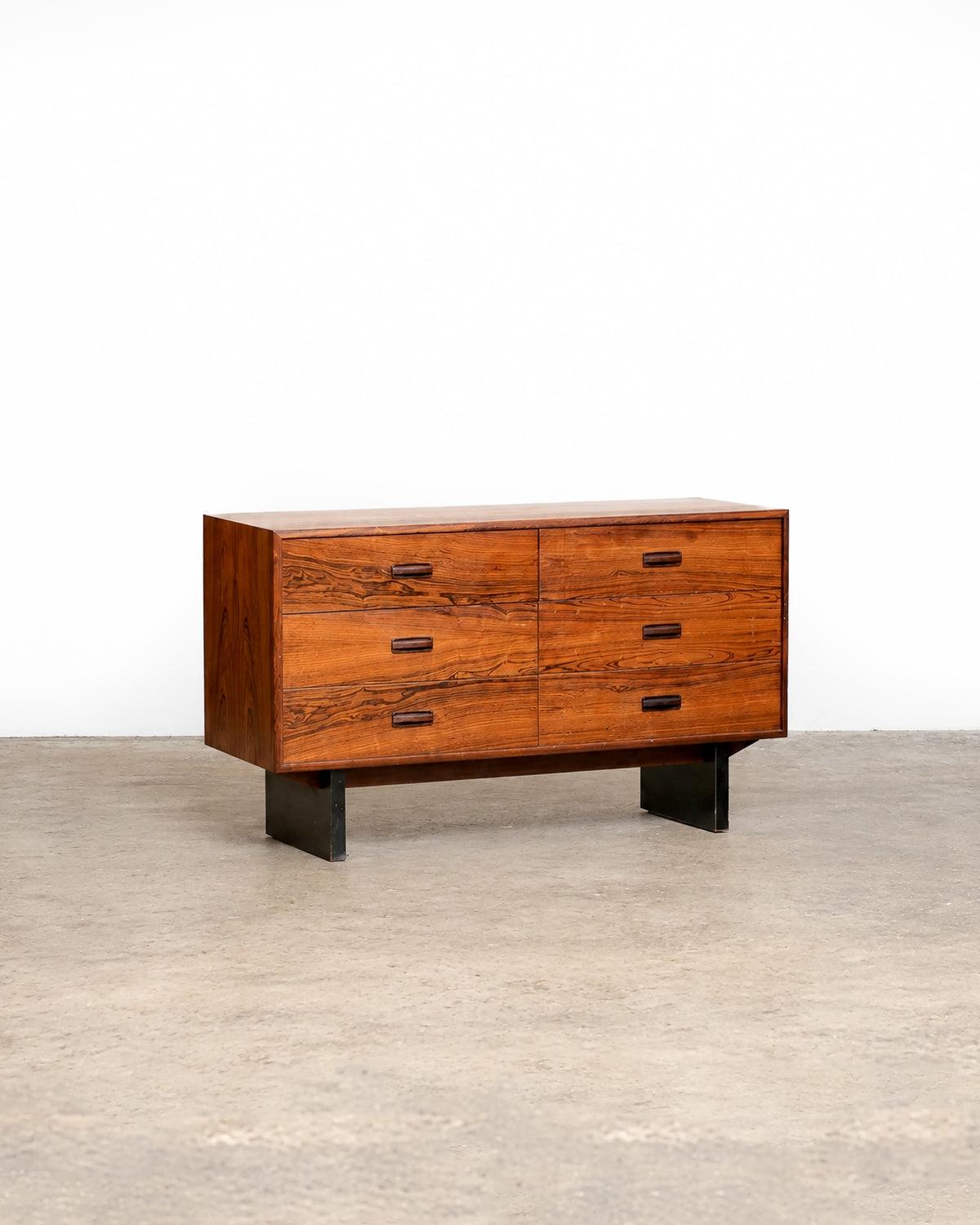 Additional angle of the rosewood 6-drawer dresser showing overall form and finish.