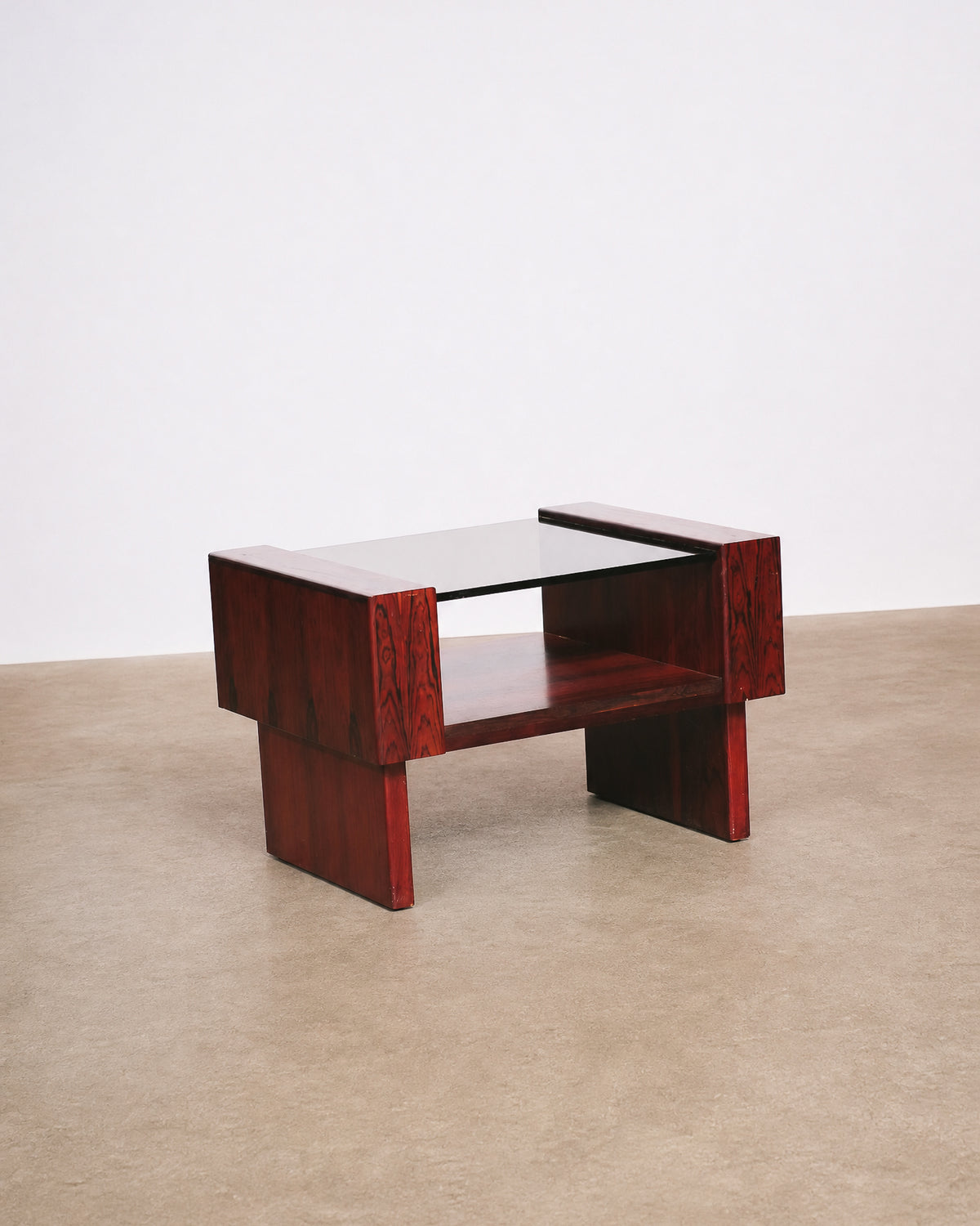 Close-up detail of the table's leg and lower shelf construction.