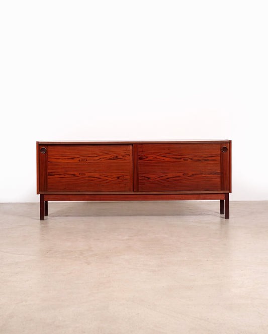 Mid-century modern rosewood credenza on a plain white background — beautifully figured rosewood grain