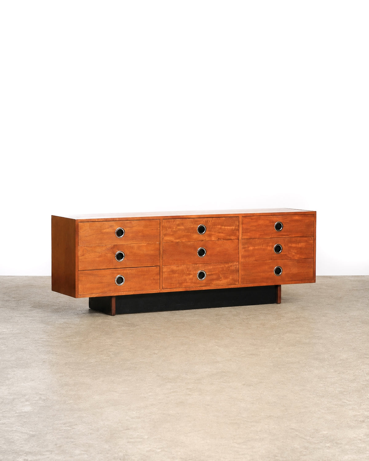 Mid-century modern teak 9-drawer dresser by RS Associates on a plain white background — rich teak grain and long low profile