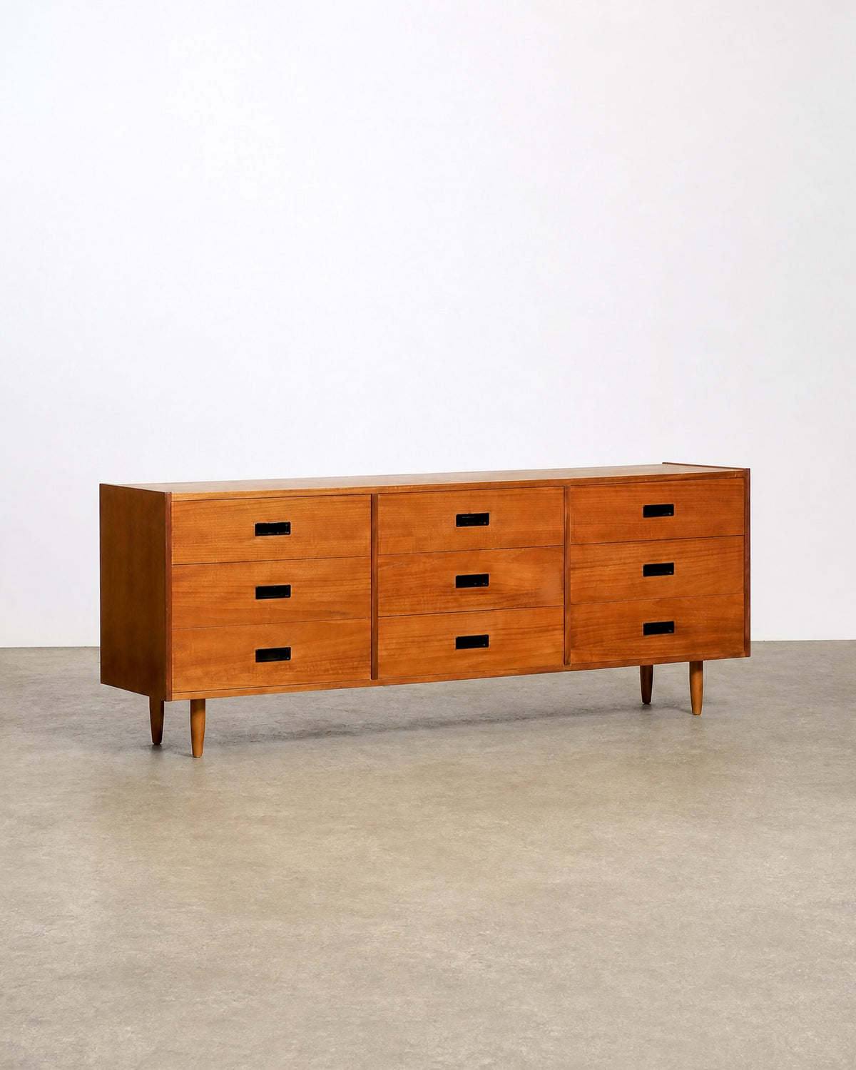 Wide view of the dresser in the showroom among other vintage furniture