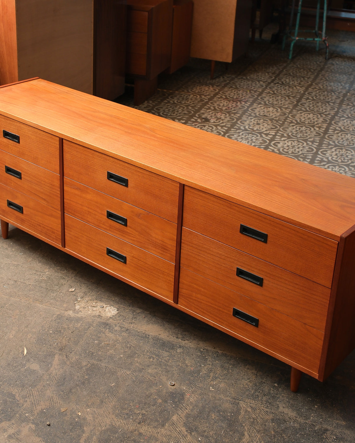 Overhead angled view highlighting the restored teak top and drawer fronts