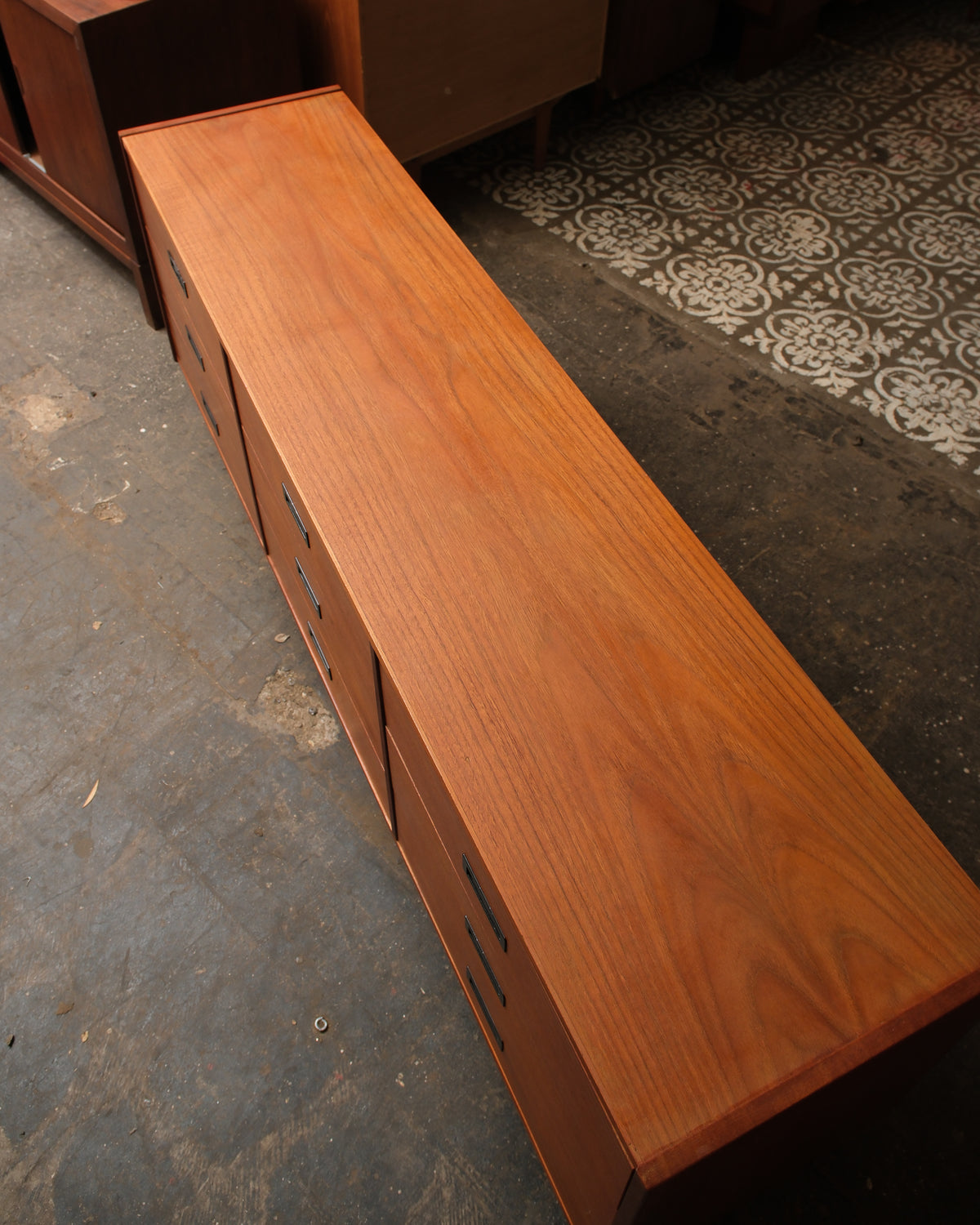 Top-down view showing the restored teak top grain and drawer pulls
