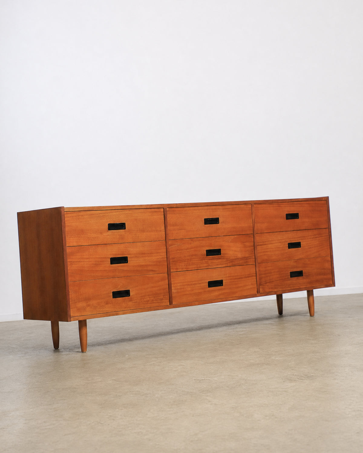 Detail view of drawer pulls and joinery along the top edge