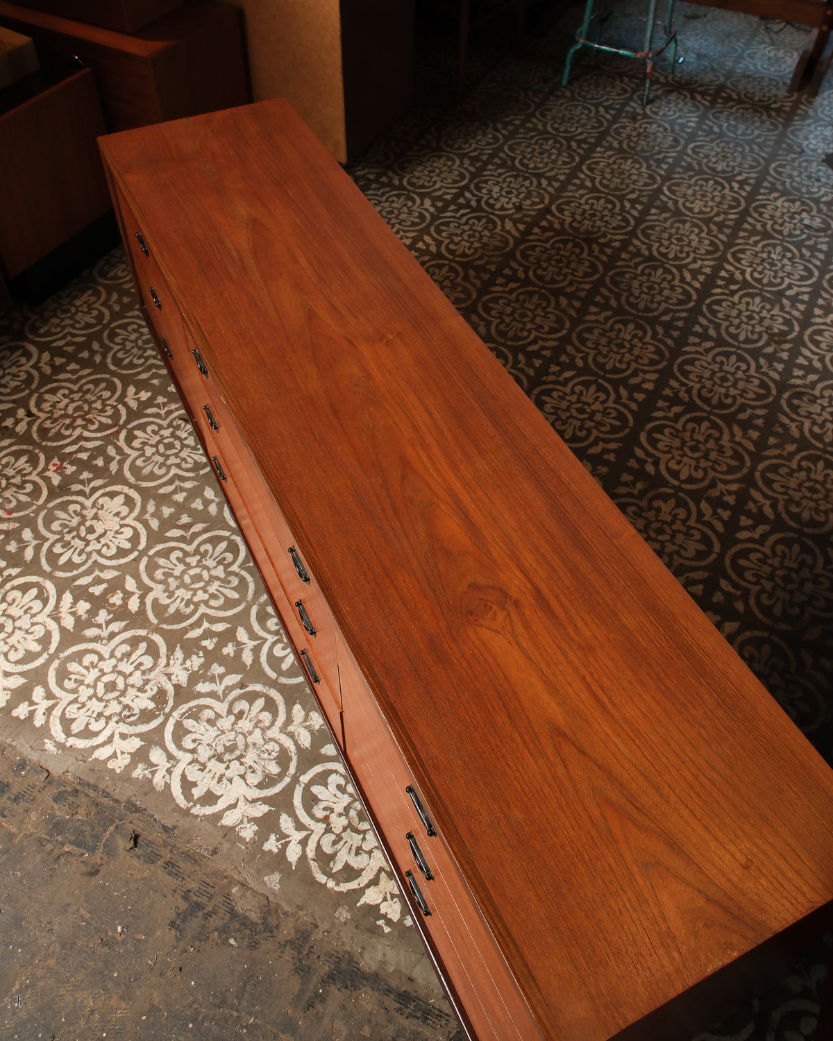 Overhead angled view of the dresser showing the top surface grain and drawer fronts.
