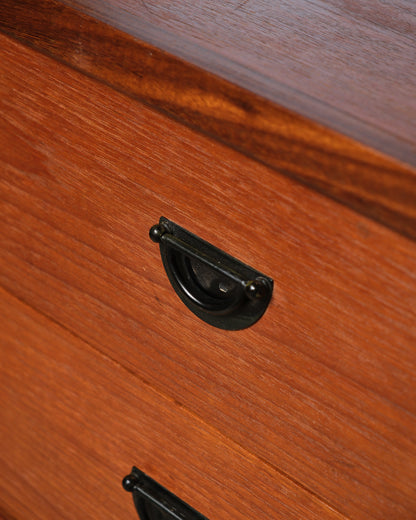 Additional angle of the teak dresser highlighting its overall proportions.