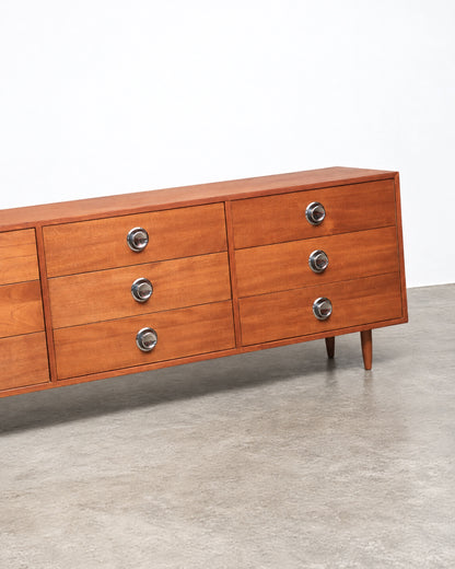 Additional angle of the teak dresser showing the case construction and drawer alignment.