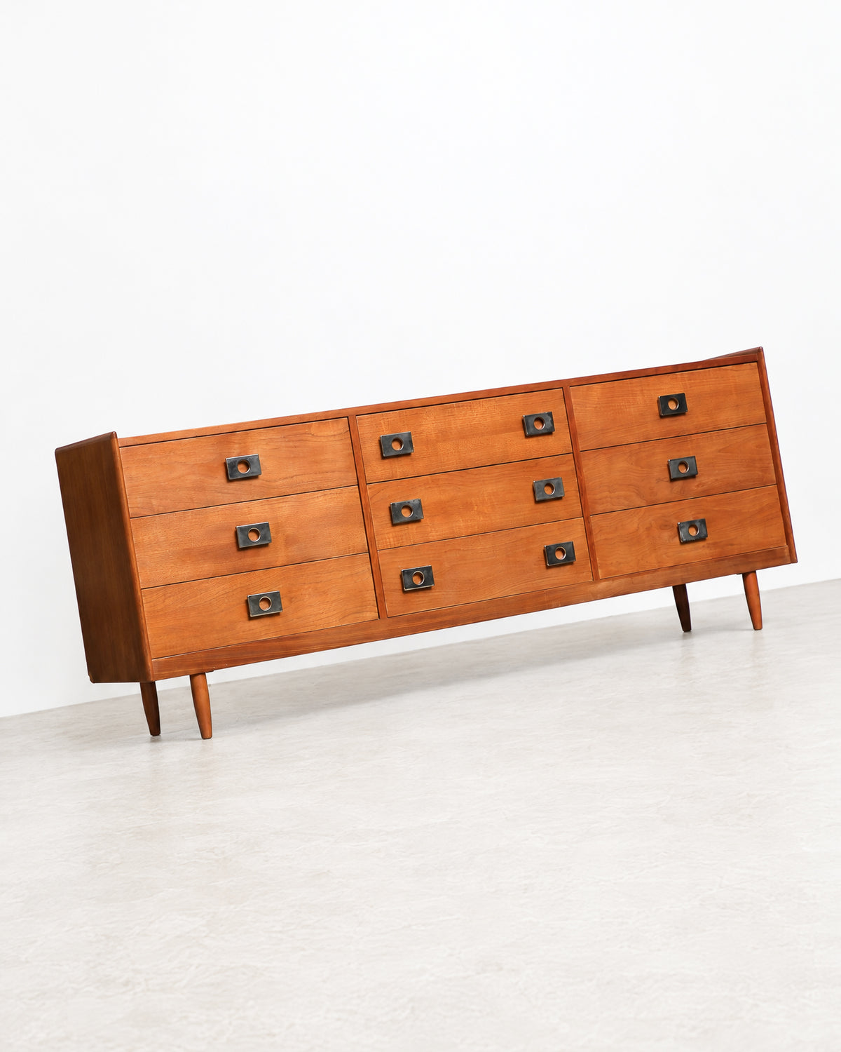 Side angle view of the dresser highlighting the case construction and wood grain.