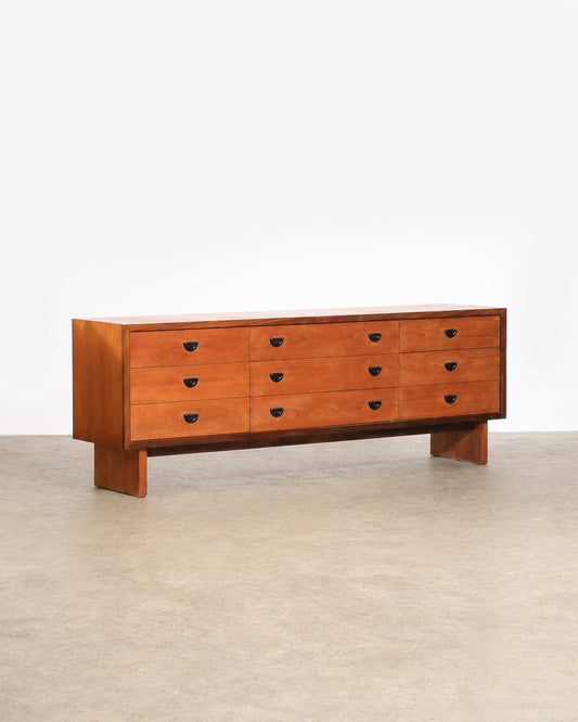 Side view of the dresser showing depth and leg construction.