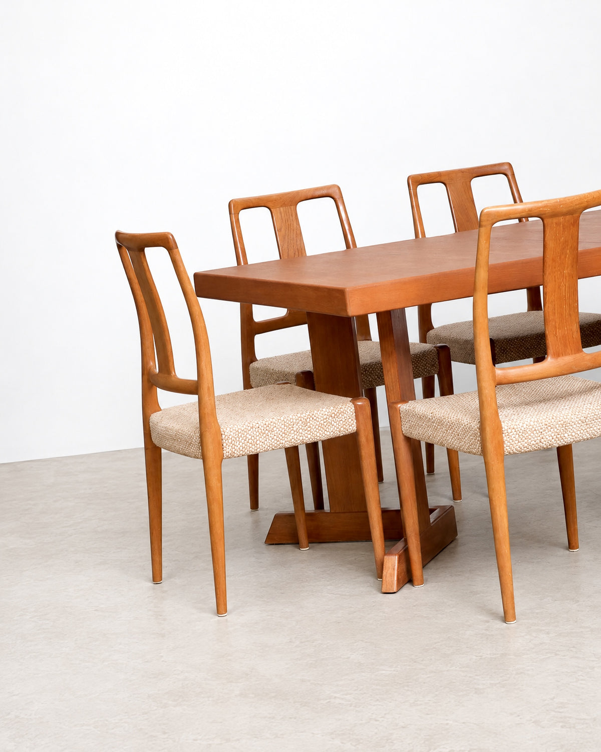 Group view of several chairs showing consistent craftsmanship and upholstery