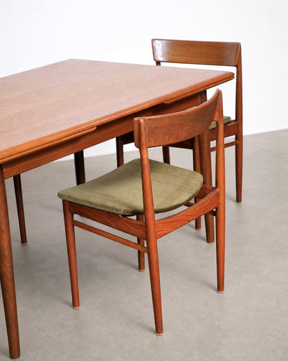 Wide shot of dining set staged in warehouse setting