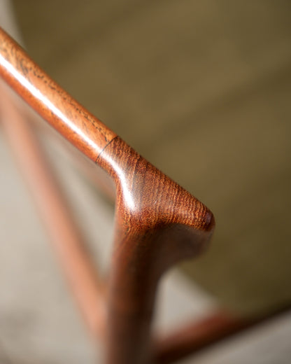 Detail of chair backrest joint showing teak grain and craftsmanship