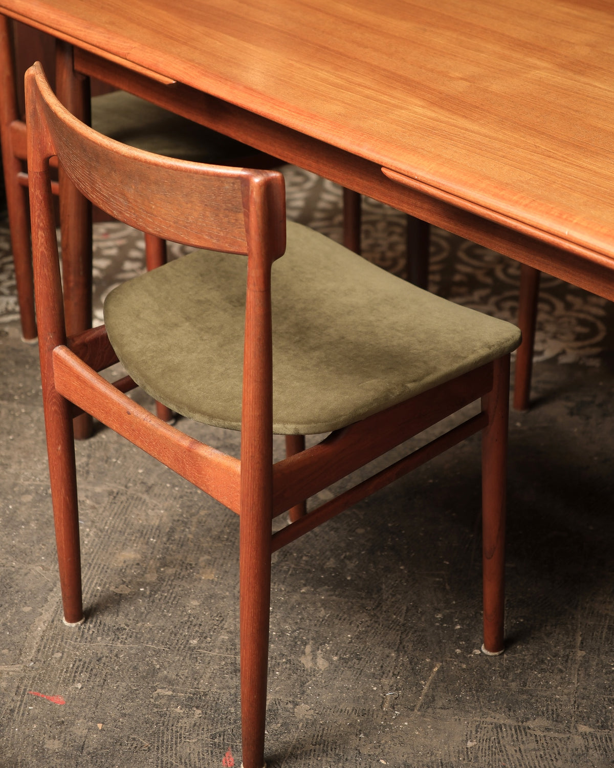Angled view of table and chairs showing overall proportions