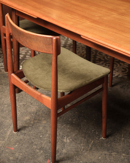 Angled view of table and chairs showing overall proportions