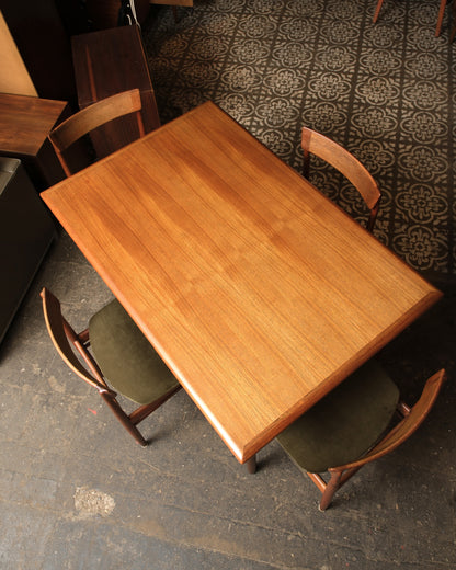 Close-up of table leaf extension mechanism underneath the top