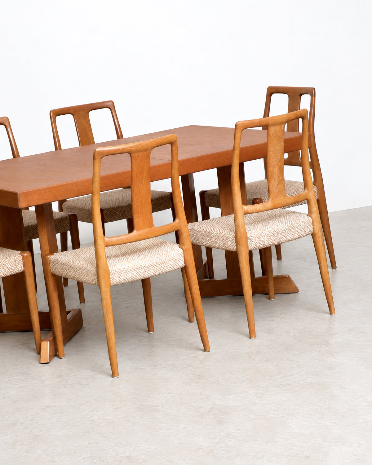 Wide view of the dining table with chairs positioned around it