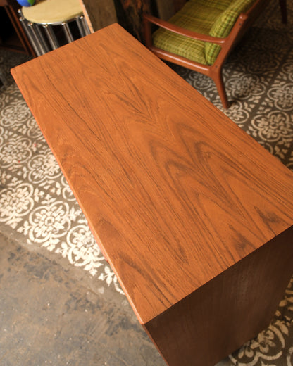 Close-up of the teak top grain and wood figuring on the gentleman's chest.