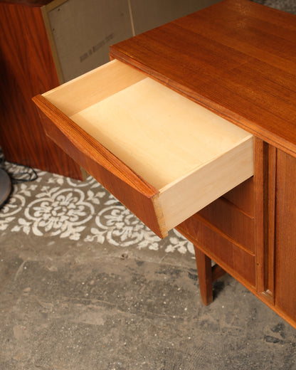 Close-up of an open drawer showing dovetail joinery and interior construction.