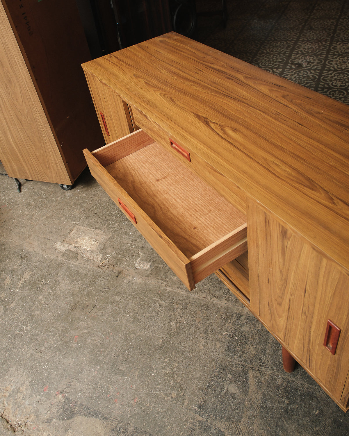 Close-up of an open drawer showing joinery and interior finish.