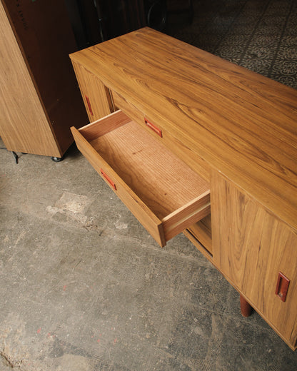 Close-up of an open drawer showing joinery and interior finish.