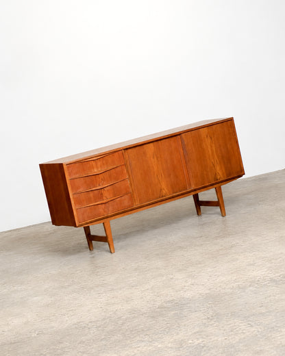 Full front angled view of the teak sideboard against a plain white backdrop.