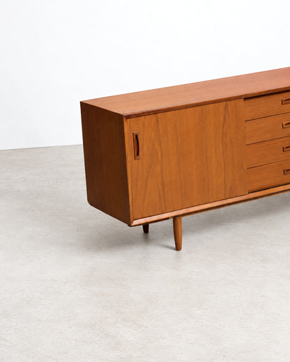 View of the sideboard's tapered wooden legs and base