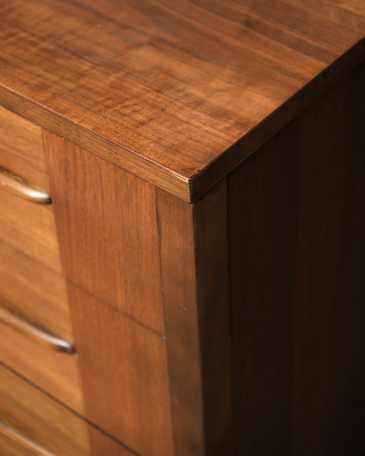 Close-up of the top corner joinery and drawer pulls
