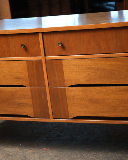 Close-up of the two right-hand drawer pulls and the sculpted drawer front detail.