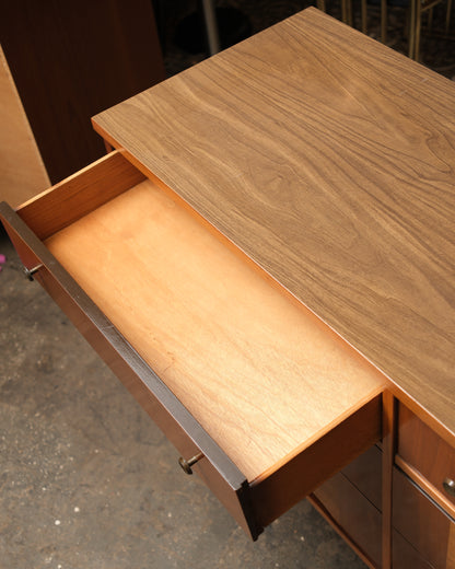Side view highlighting the depth of the case and the taper of the legs.