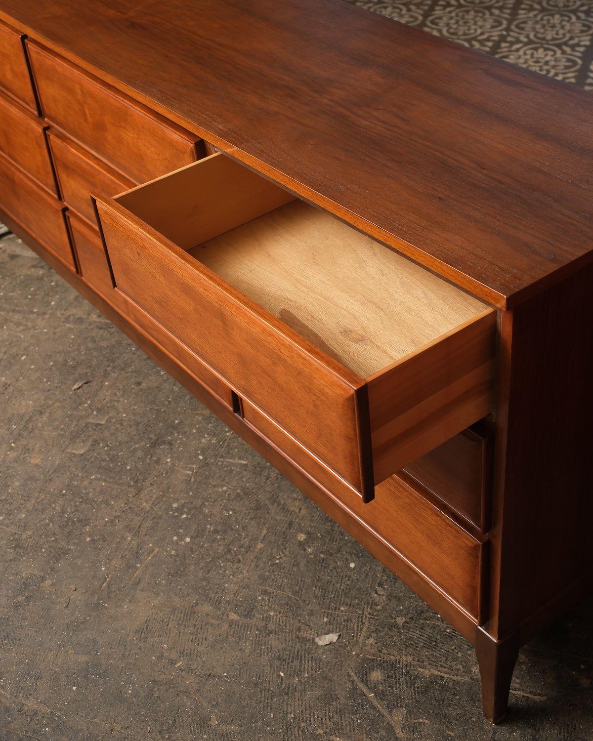 Detail of an open drawer showing interior construction and the drawer's wood joinery.