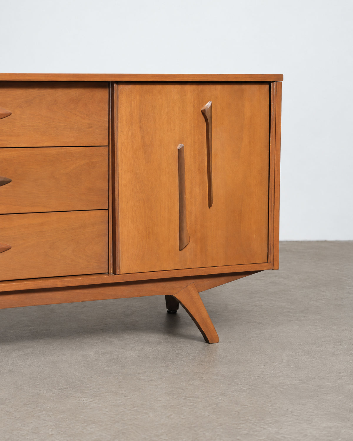 Full side profile showing the tapered splayed legs and case depth.