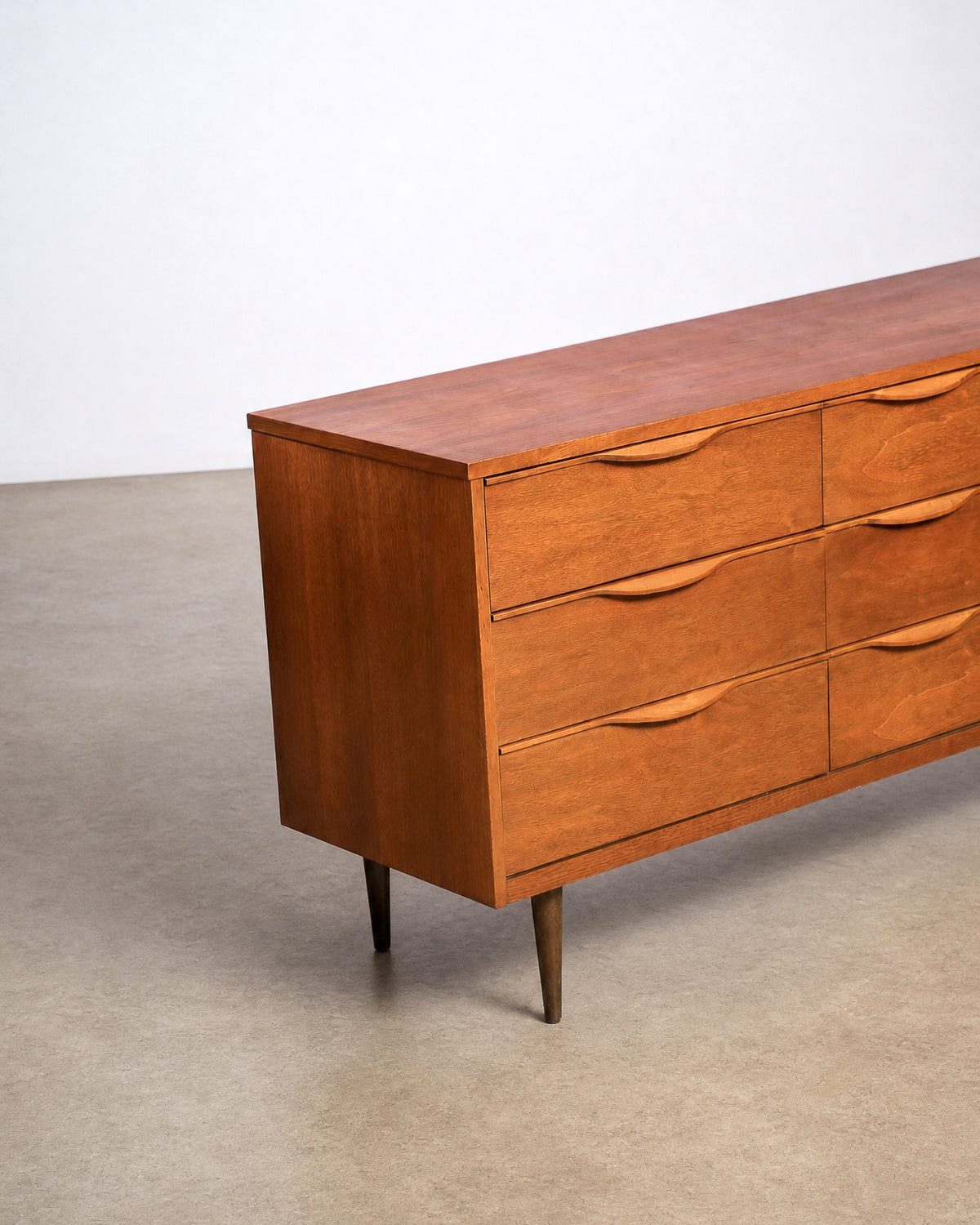 Detail of the dresser's tapered brass-capped leg.