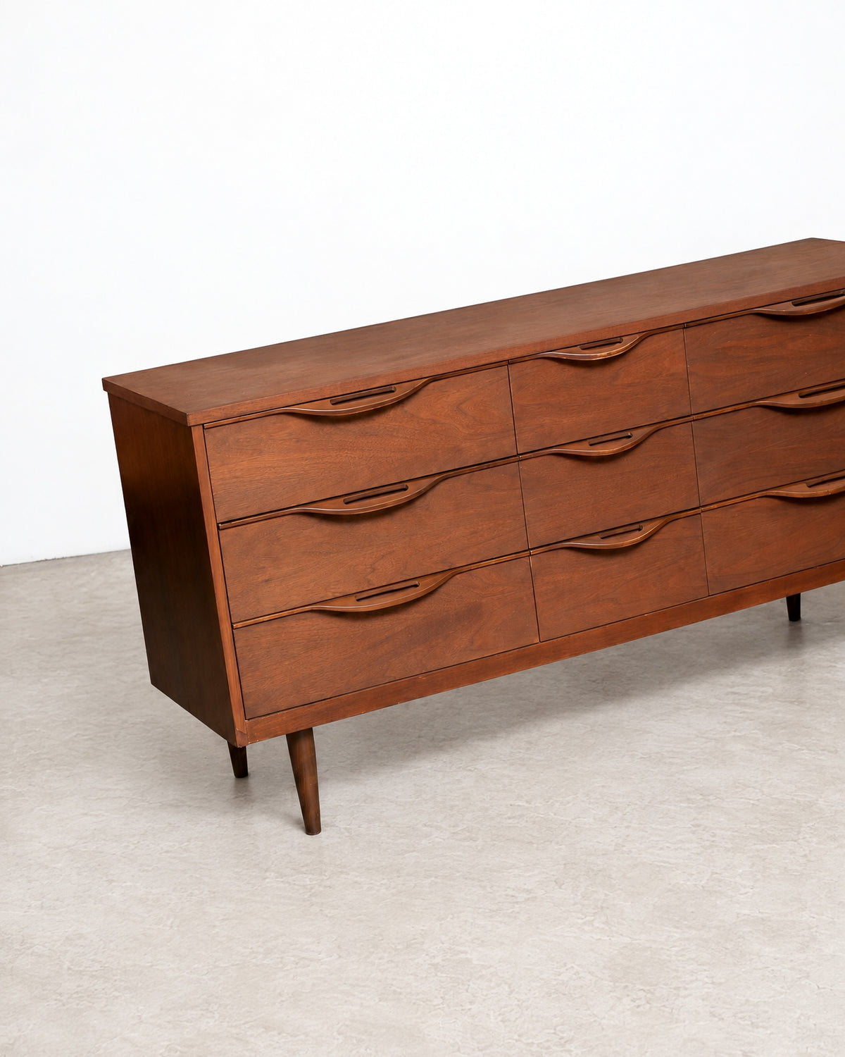 Angled view of the dresser top and drawer handles from above