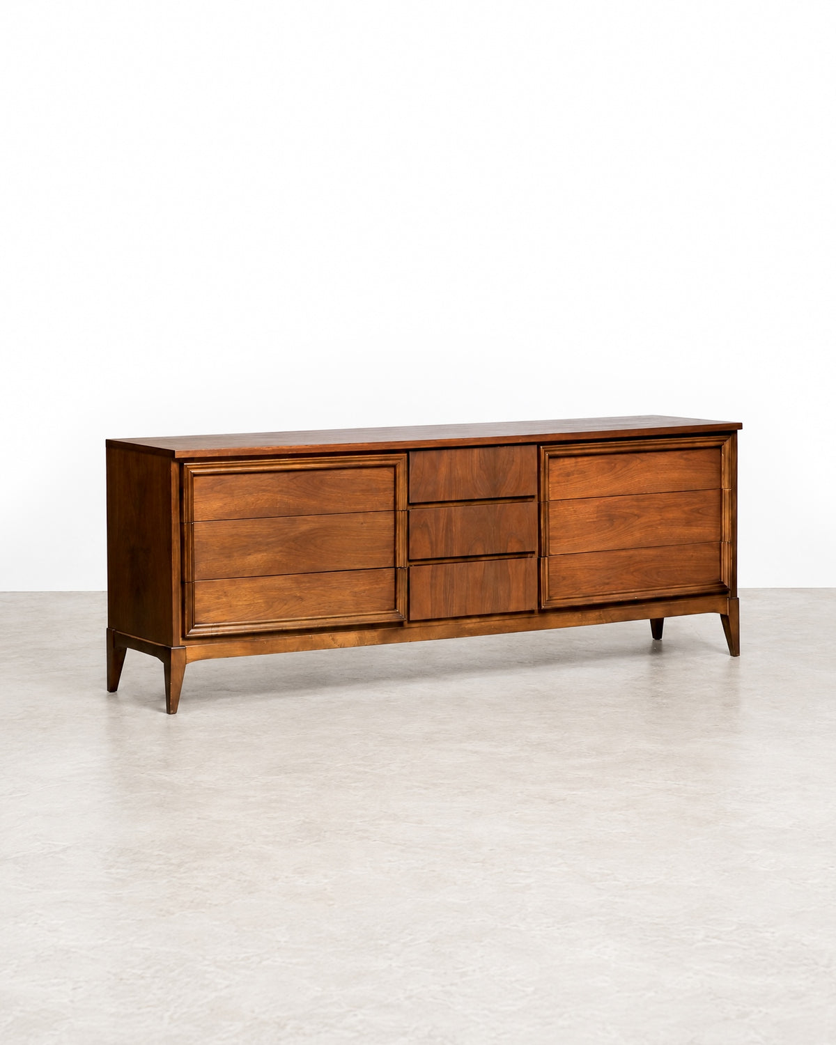 Additional angle of the dresser showcasing the walnut finish and drawer construction.