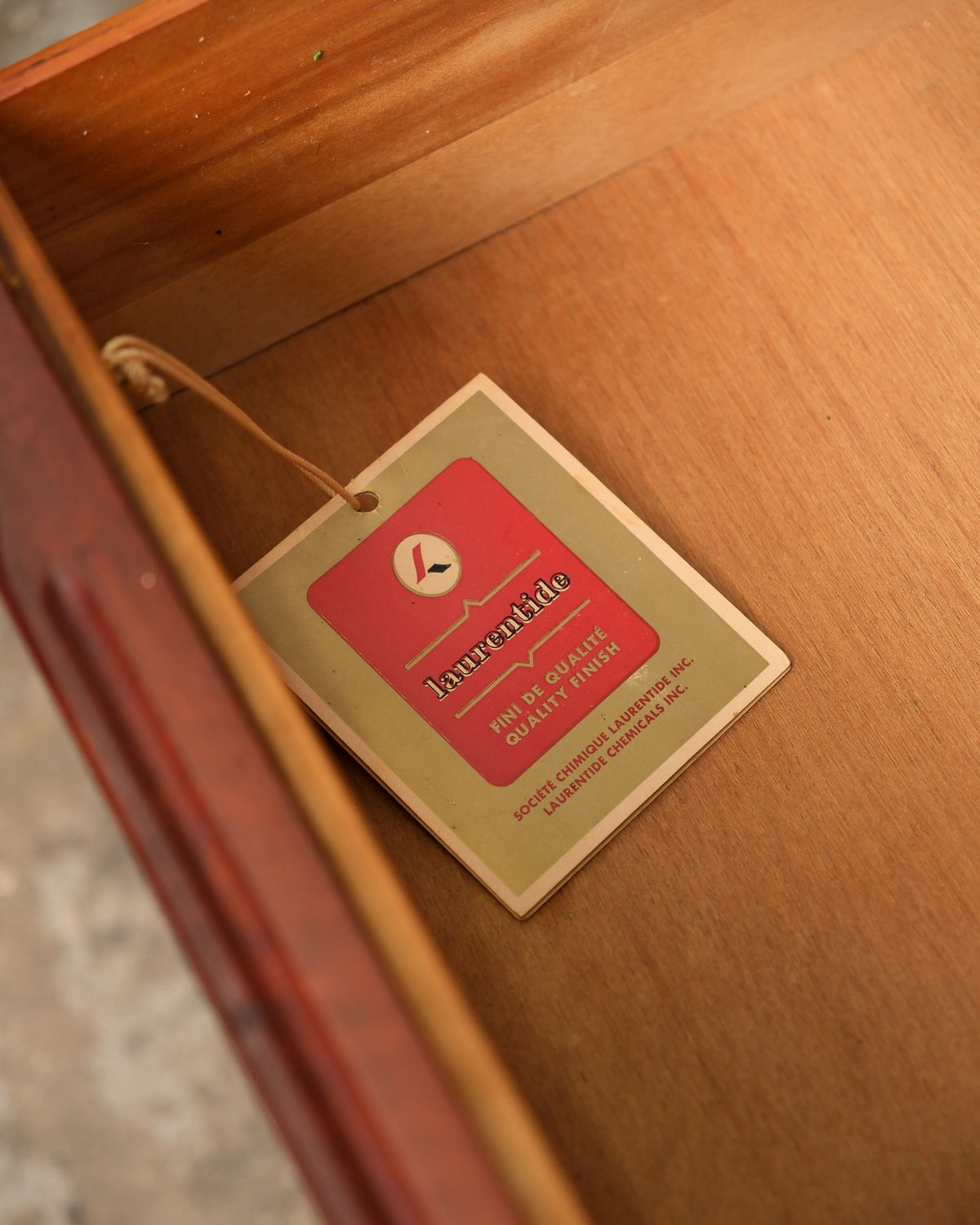 Close-up of the Laurentide quality finish label inside a drawer
