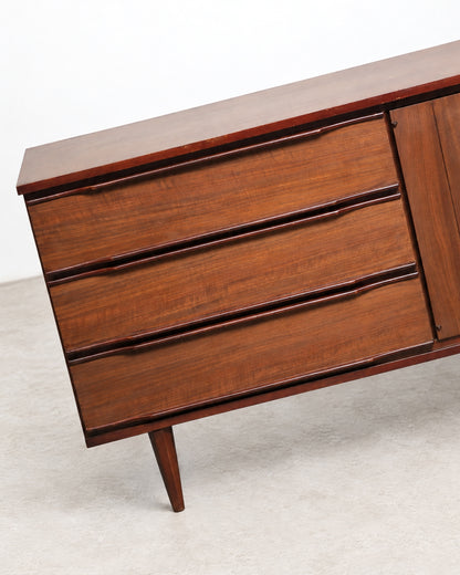 Side angle view of the credenza showing depth and tapered leg design