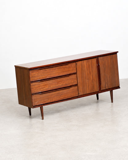 Close-up of the walnut grain pattern across the cabinet doors