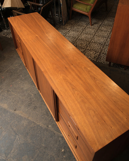 Top-down view showing the walnut grain pattern across the sideboard's surface and drawer fronts.