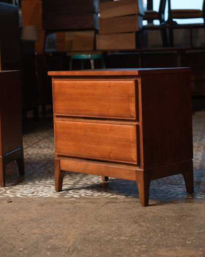 Front and side view of a single walnut nightstand showing tapered legs and drawer detail.