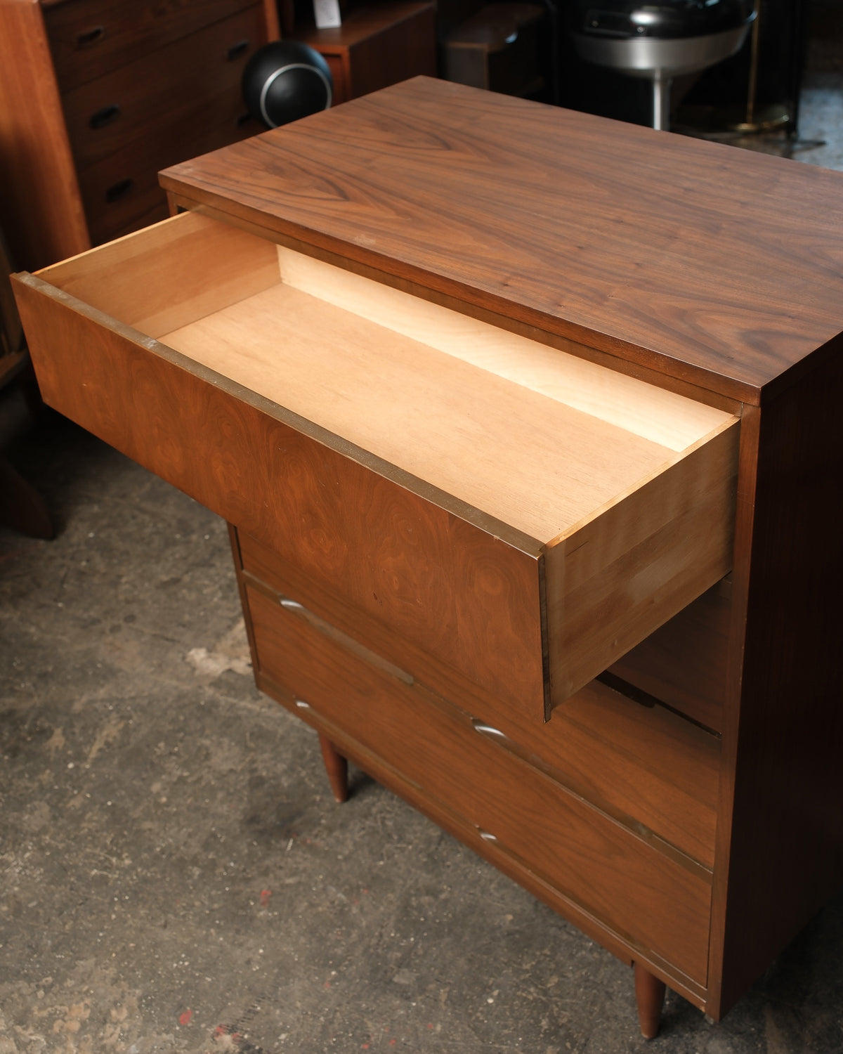 Top drawer open showing interior construction and empty storage space.