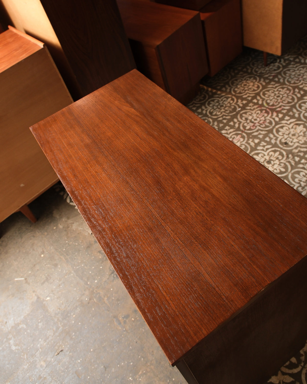 Overhead view of the walnut tallboy dresser top showing grain pattern and finish.
