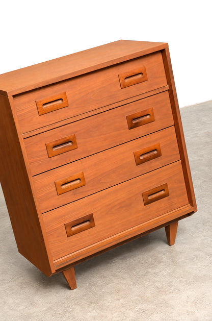 Close-up angled view highlighting the walnut grain, drawer pulls, and top edge detail.