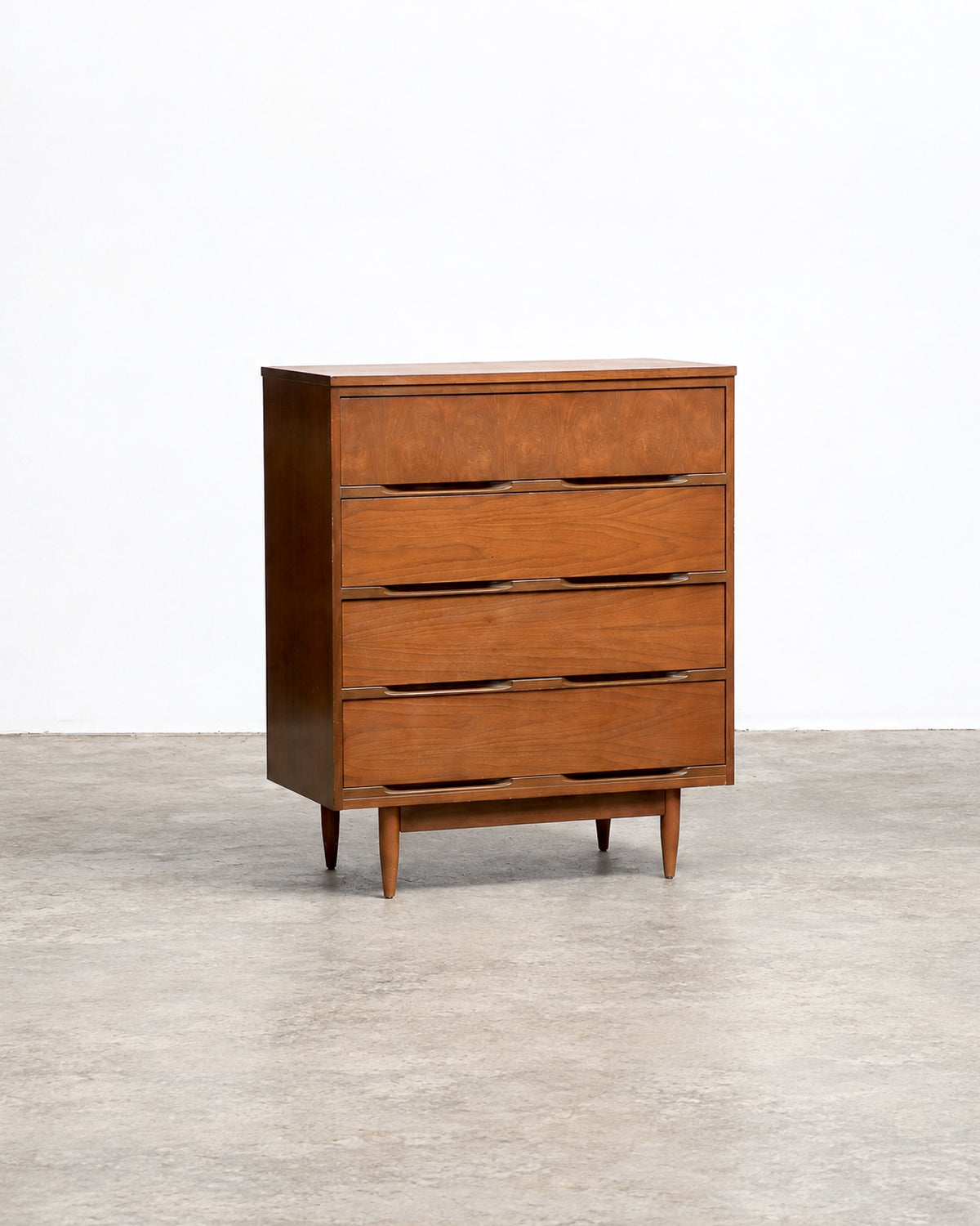 Side angle view of the dresser showing depth and tapered leg design.