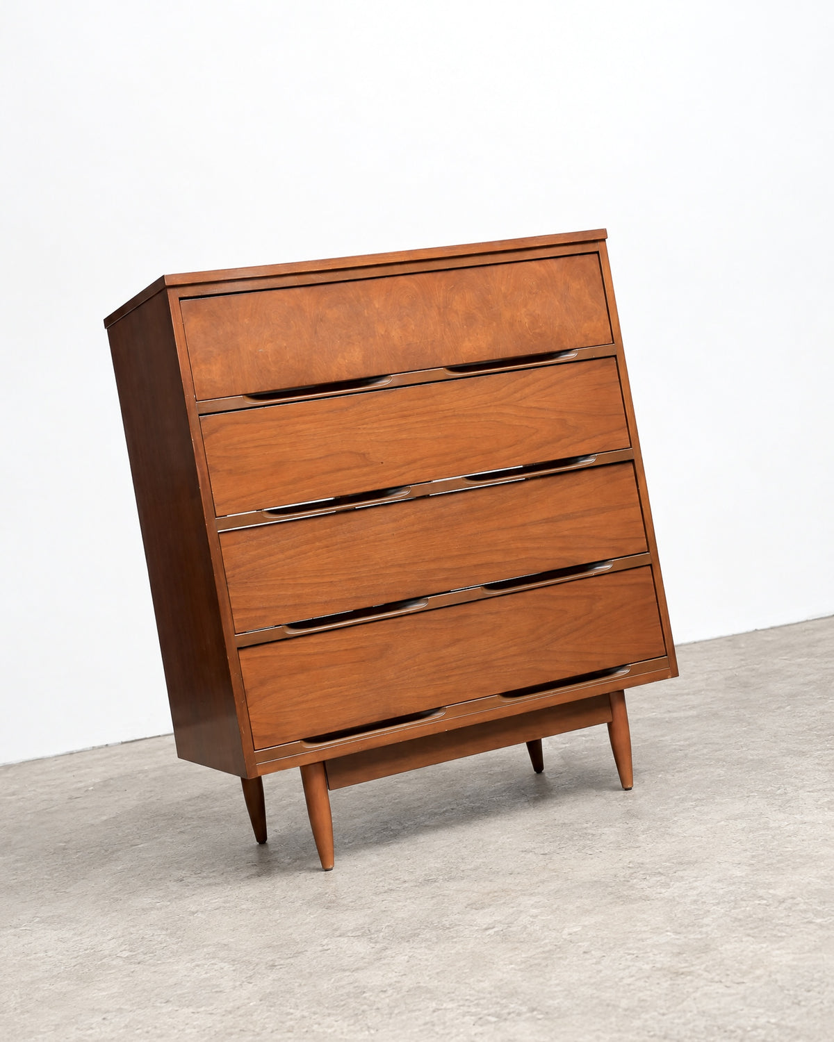 Close-up of the dresser's top surface and front edge detailing.