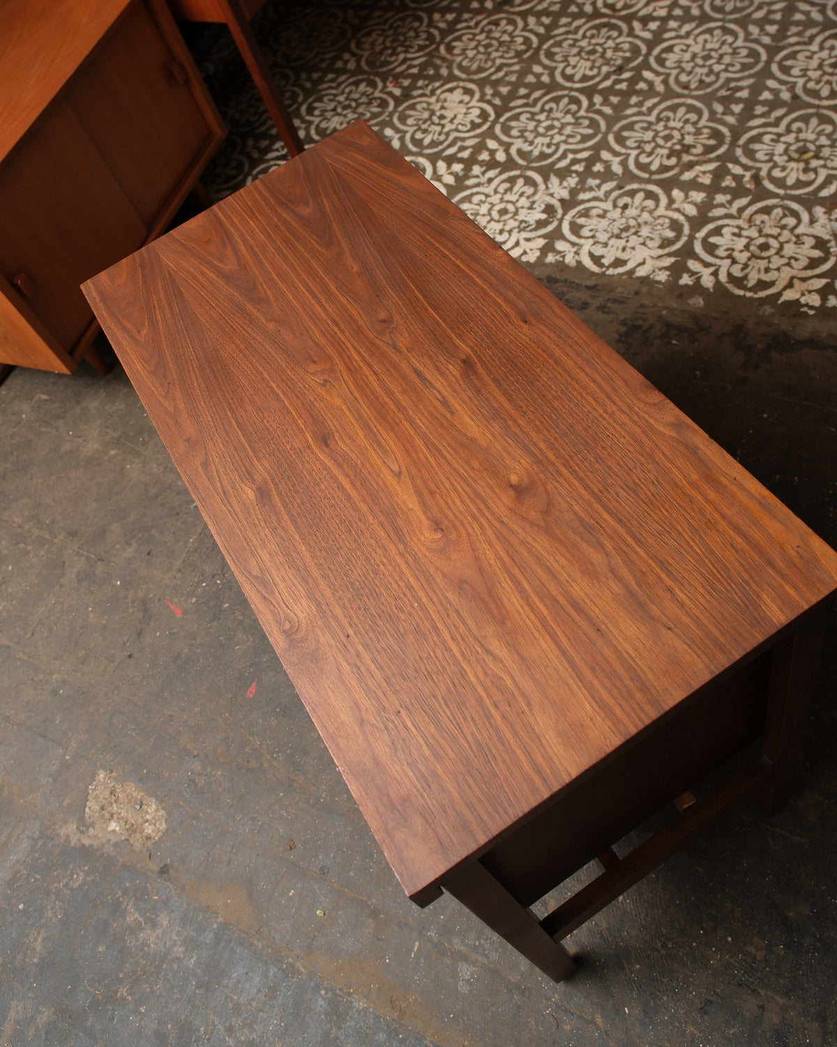 Overhead view of the walnut top showing natural wood grain and finish