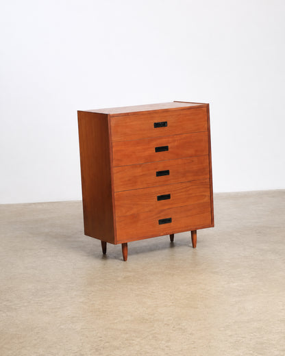 Three-quarter view of the tallboy dresser against a plain studio background.