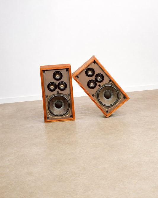 Full pair of speakers photographed together in the showroom setting.