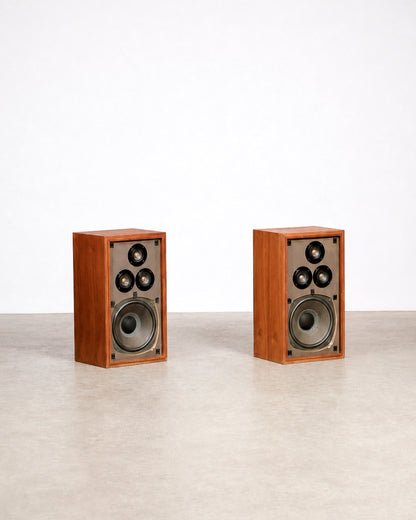 Side angle of the walnut speaker cabinet showing the wood grain and joinery.
